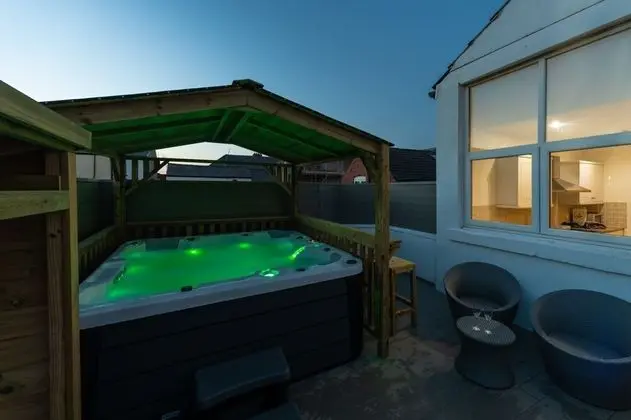 THE Bells hot tub on Private Terrace Apartments