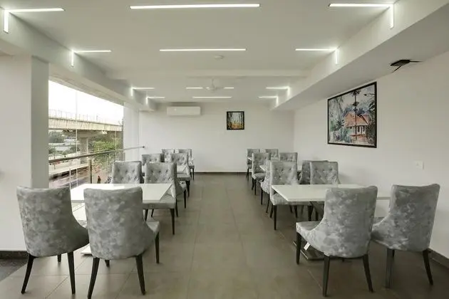 Capital O 22459 Edasserys Kalamassery Tourist Home - Yerinde Yemek