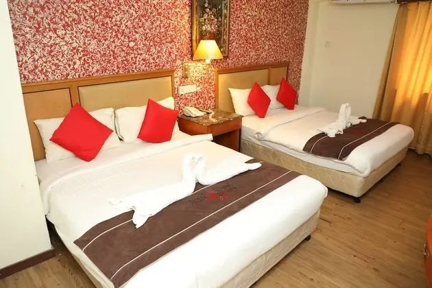 Capital O 90125 Hotel Grand Orchard - Oda