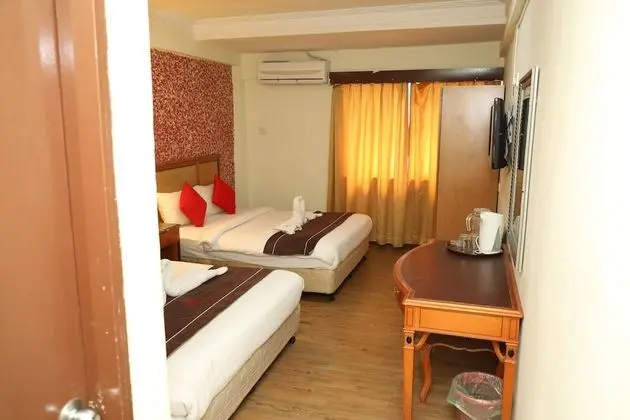 Capital O 90125 Hotel Grand Orchard - Oda