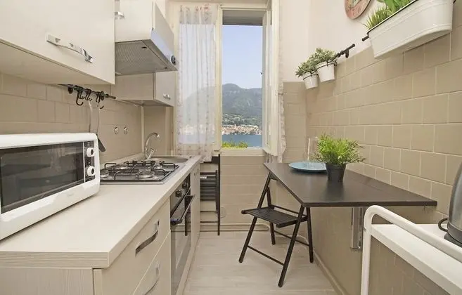 Cisano Beach Apartment - Mutfak
