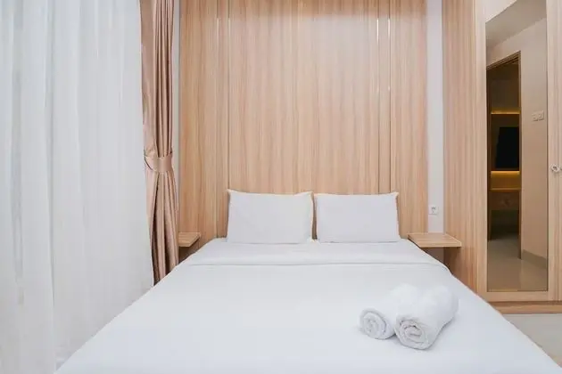 Clean and Elegant 1BR at The Oasis Apartment