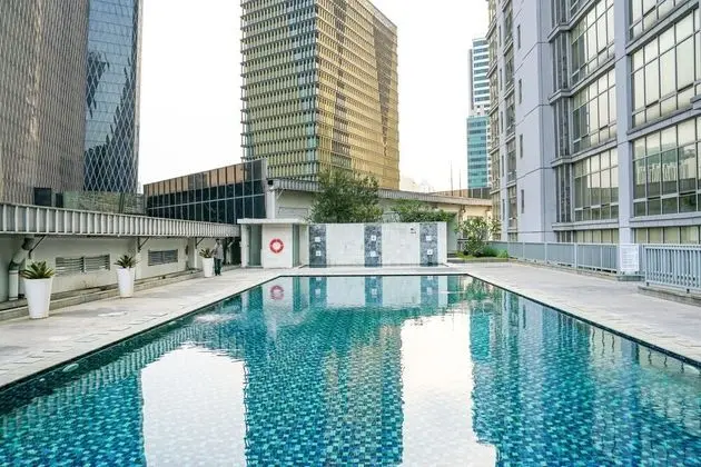 Comfy and Spacious 2BR The Masterpiece Epicentrum Apartment By Travelio