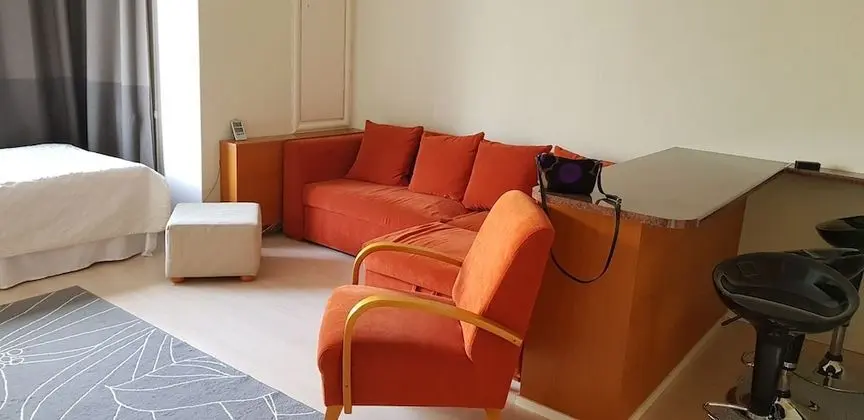 Cosy studio in front of a small church