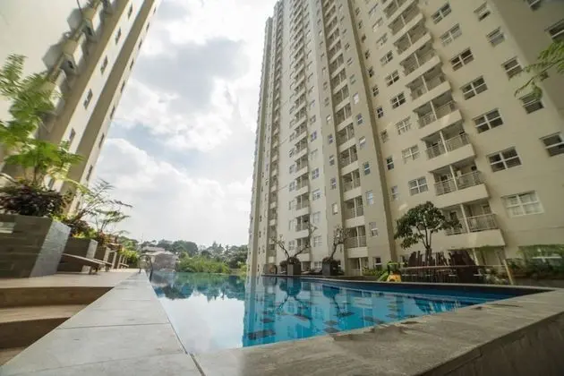 Cozy Apartment at Parahyangan Residence with Direct Access to Swimming Pool