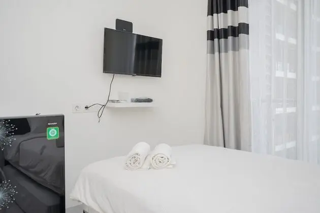 Elegant and Comfortable Studio Apartment at Sky House BSD - Oda