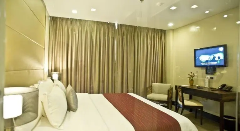 Goldberry Suites and Hotel - Oda