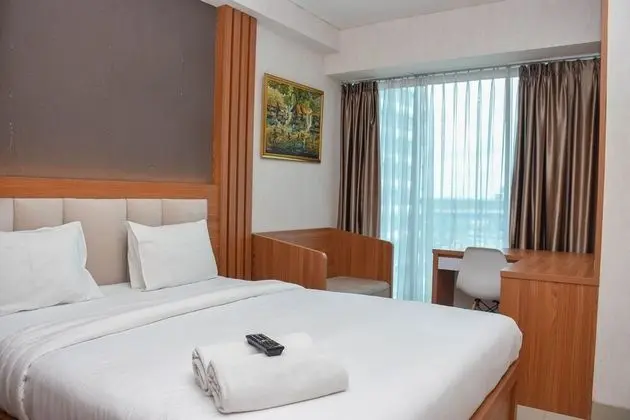 Homey 1Br With Living Room At Grand Kamala Lagoon Apartment - Oda