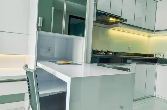 Homey and Comfy 1BR at Casa de Parco Apartment - Mutfak