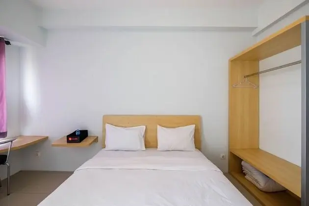 Homey and Comfy Studio Tamansari Mahogany Apartment