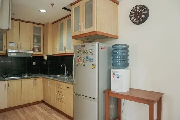 Homey and Modern with City View 2BR Poins Square Apartment - Oda