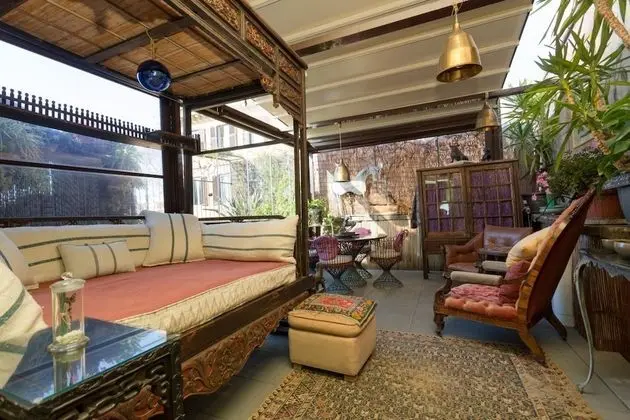 Lounging in the Green Terrace Under The Roman Sky