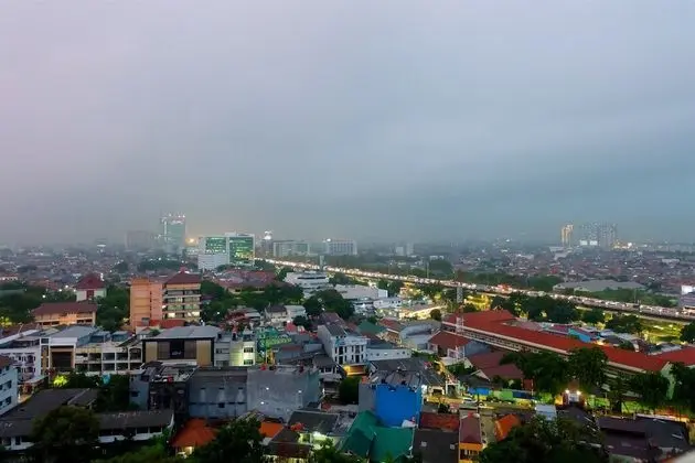 Minimalist Studio with City View at Green Pramuka Apartment