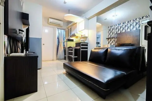 Monochrome Style 2 Bedrooms at Kalibata City Apartment By Travelio