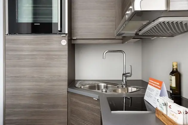 numa l Topp Apartments - Mutfak