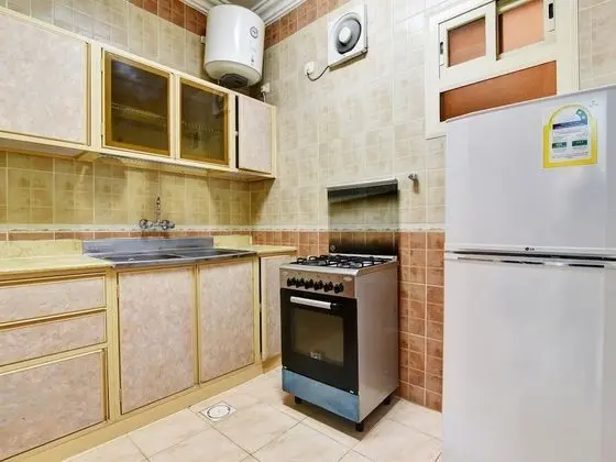 OYO 404 Rwnza Hotel Apartments - Mutfak