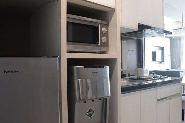 Pleasant and Homey 2BR Apartment at Tamansari La Grande - Mutfak