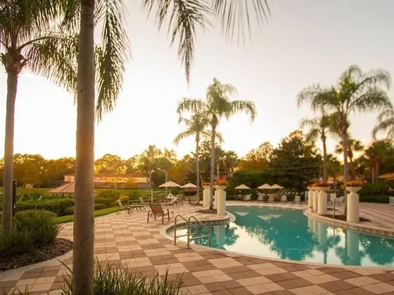 Private Screened Splash Pool Overlooking Tranquil Lake Right Beside Disney World by Florida Dream Homes