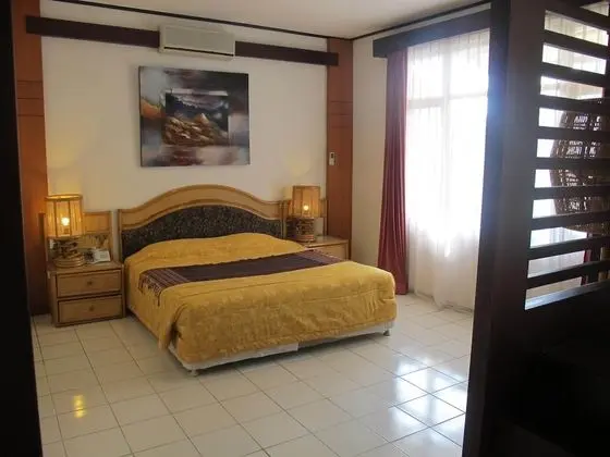 Puri Naga Beachfront Cottages - Oda