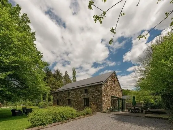 Rustic Holiday Home with Sauna & Hot Tub in Wooded Area