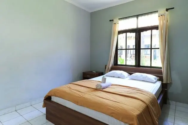 Sari Indah Cottages - Oda