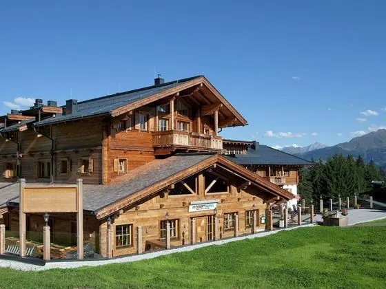 Snow-covered Elevated Homes on the Border of Salzburgerland