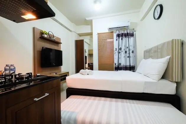 Studio Room at Green Pramuka City Apartment with Mall Access By Travelio