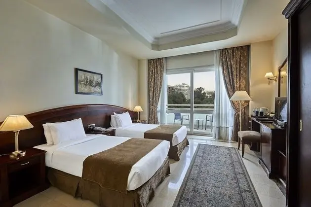 Triumph Plaza Hotel - Oda