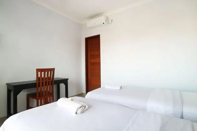 The Wina Echo Beach Guesthouse - Oda