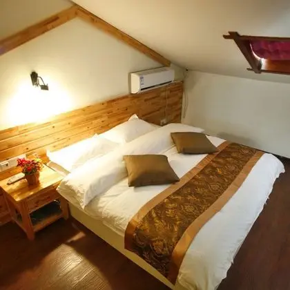 Wulingyuan Tu Youth Hostel - Oda