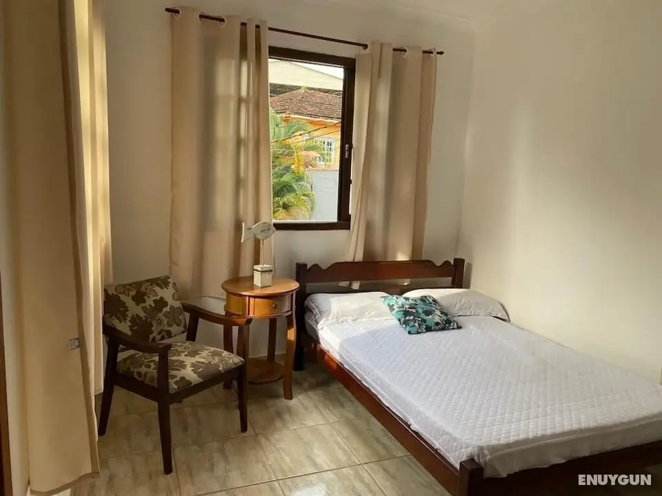 Suítes aconchegantes com piscina e praia - Oda