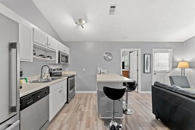 Ev (6100 Pinetree Ave)