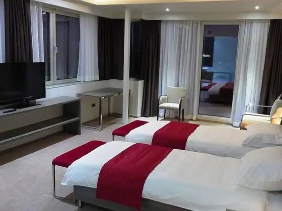 Deluxe Tek Büyük veya İki Ayrı Yataklı Oda