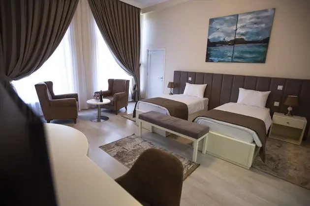 Deluxe Tek Büyük veya İki Ayrı Yataklı Oda