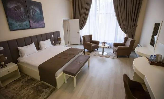 Deluxe Tek Büyük veya İki Ayrı Yataklı Oda
