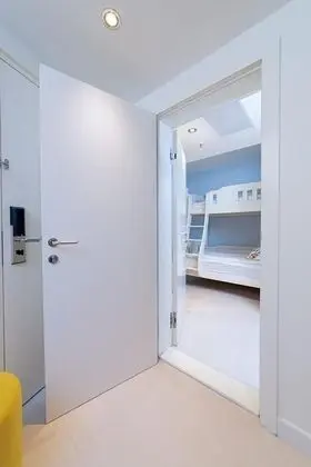 Two Family Rooms with Connecting Door 62m² Courtyard/Park View with Balconies