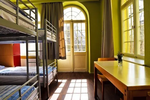 one bed in 4 bed woman only dorm, shared bathroom