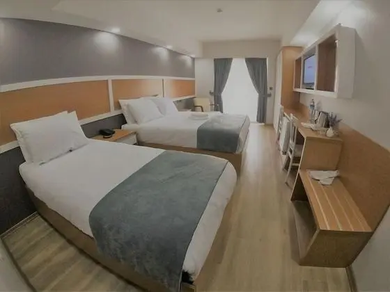 Deluxe Tek Büyük veya İki Ayrı Yataklı Oda