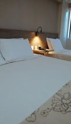 Quarto Triplo Superior com Vista Lateral do Mar