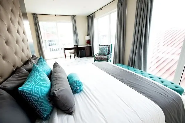Luxury King Suite with Balcony and Town View