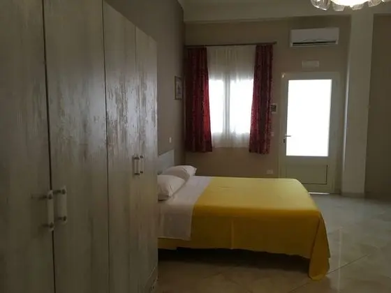 Deluxe Dört Kişilik Oda, Veranda, Bahçe Manzaralı