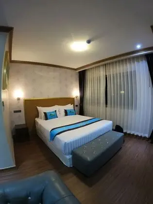 Deluxe Tek Büyük veya İki Ayrı Yataklı Oda