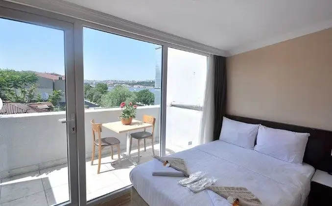 Deluxe Üç Kişilik Deniz manzaralı Oda