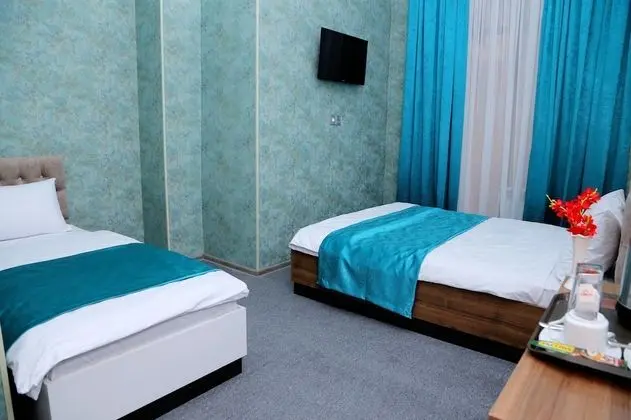 Standard Üç Kişilik Oda, Bahçe Manzaralı