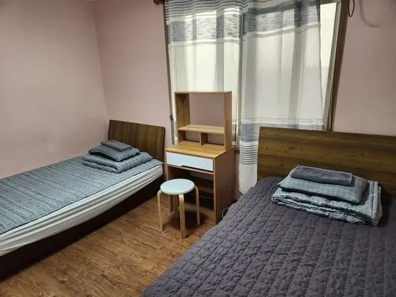 1 x Private Triple Room(Shared Bathroom) (1 Double Bed, 1 Single Bed)
