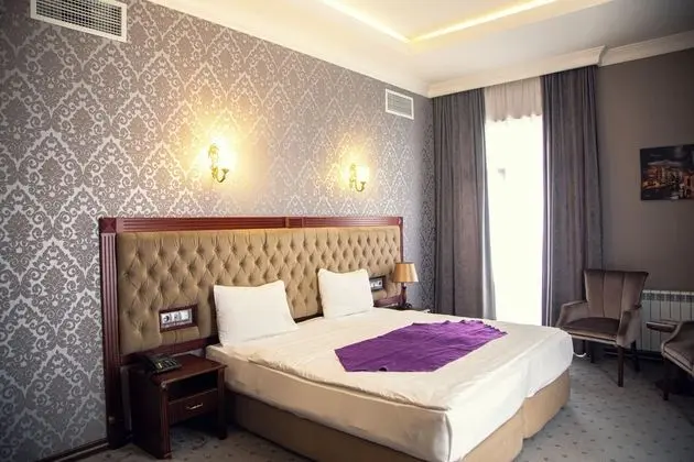Deluxe Tek Büyük veya İki Ayrı Yataklı Oda