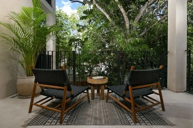 Luxury Suite with King Bed Balcony and Garden View