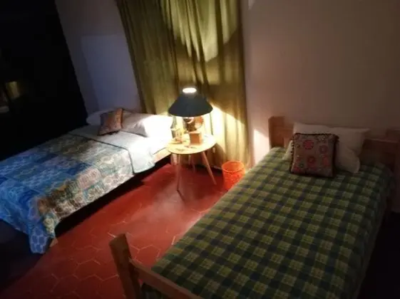 Room 1 queen bed and 1 twin bed