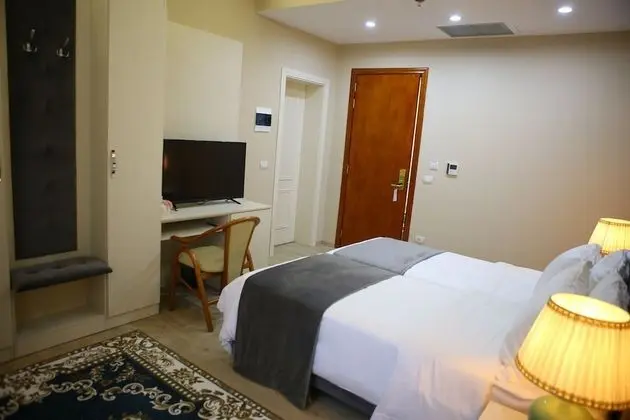 Deluxe Tek Büyük veya İki Ayrı Yataklı Oda