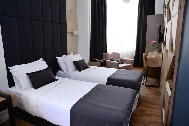 Deluxe Tek Büyük veya İki Ayrı Yataklı Oda